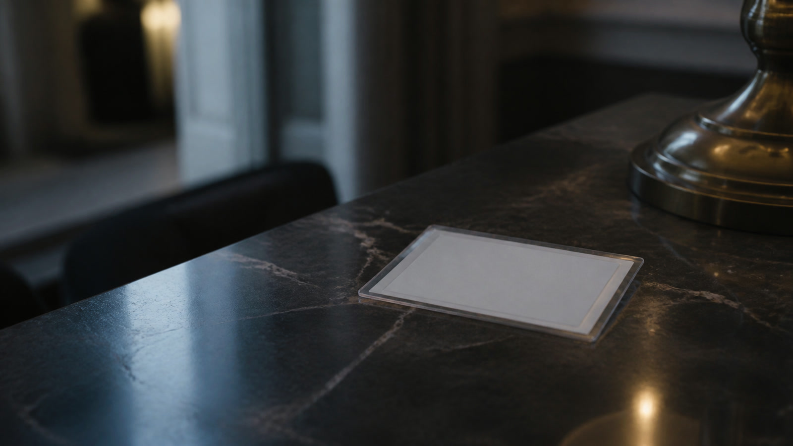A residence-permit card in a plastic sleeve on a counter