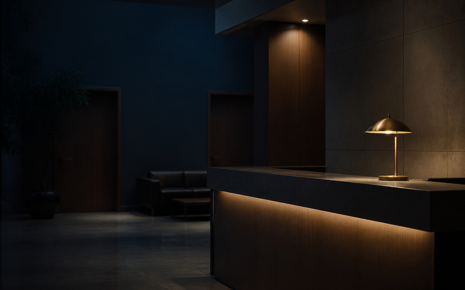 A police station front desk at night, empty, one lamp burning