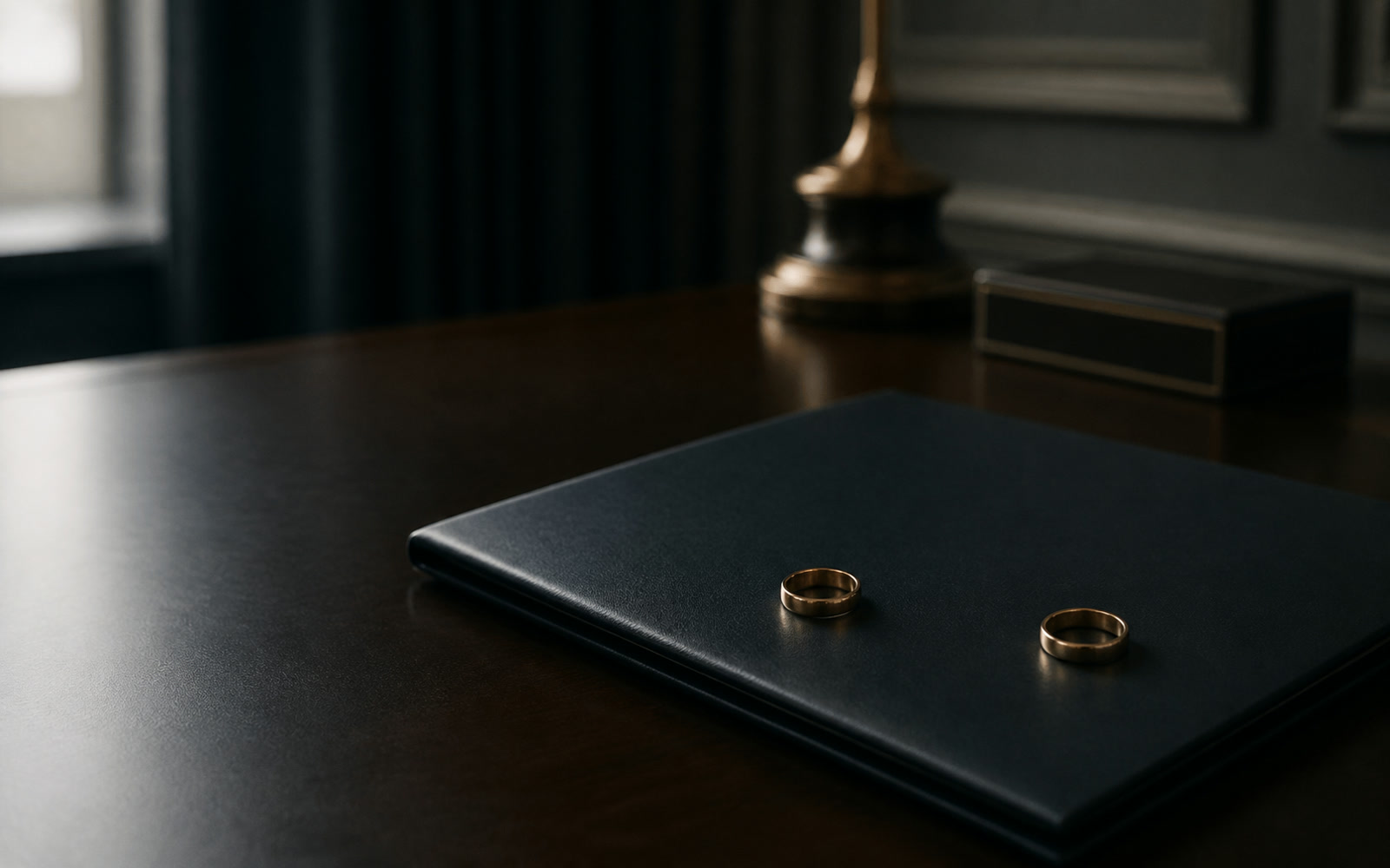 Two rings left on a document folder on a desk